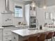 Bright kitchen features white cabinets, stainless steel appliances, and marble countertops at 2769 Rivertowne Pkwy, Mount Pleasant, SC 29466