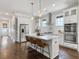 Bright kitchen features white cabinets, stainless steel appliances, marble countertops, and a spacious island at 2769 Rivertowne Pkwy, Mount Pleasant, SC 29466