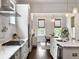 Modern kitchen with white cabinets, stainless steel appliances, and marble countertops at 2769 Rivertowne Pkwy, Mount Pleasant, SC 29466