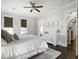 Bright main bedroom features neutral walls, ceiling fan, and white trim, creating a peaceful retreat at 2769 Rivertowne Pkwy, Mount Pleasant, SC 29466