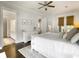 Bright main bedroom with french doors, ceiling fan, and an attached bathroom at 2769 Rivertowne Pkwy, Mount Pleasant, SC 29466