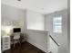 Upstairs hallway featuring hardwood floors and built in office space at 2769 Rivertowne Pkwy, Mount Pleasant, SC 29466