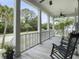 Spacious covered porch with rocking chairs and a hammock, perfect for enjoying the outdoors at 2769 Rivertowne Pkwy, Mount Pleasant, SC 29466