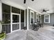 Charming covered porch featuring rocking chairs and a tranquil outdoor living space at 2769 Rivertowne Pkwy, Mount Pleasant, SC 29466