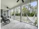 Relaxing covered porch with rocking chairs and a hammock, offering a serene outdoor space at 2769 Rivertowne Pkwy, Mount Pleasant, SC 29466