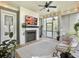 Inviting screened porch with a fireplace, TV, and comfortable seating for relaxation and entertainment at 2769 Rivertowne Pkwy, Mount Pleasant, SC 29466