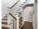 Stairway with dark treads and white risers, contrasted by a white banister and shiplap wall at 2769 Rivertowne Pkwy, Mount Pleasant, SC 29466