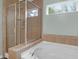 Bathroom boasts a soaking tub, separate shower, and tiled surround, creating a relaxing retreat at 281 Decatur Dr, Summerville, SC 29486