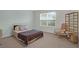 Bedroom with a comfortable bed, large window, and side chair, providing a cozy retreat at 281 Decatur Dr, Summerville, SC 29486