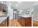 Kitchen with dark wood cabinets, granite countertops, stainless steel appliances, and an island sink at 281 Decatur Dr, Summerville, SC 29486