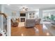 Cozy living room featuring hardwood floors, a fireplace, neutral tones, and comfortable seating at 281 Decatur Dr, Summerville, SC 29486