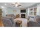 Comfortable living room featuring a fireplace, ceiling fan, and large windows at 281 Decatur Dr, Summerville, SC 29486