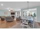 Bright living room with wood floors, fireplace, and open to the dining room at 281 Decatur Dr, Summerville, SC 29486