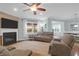 Open living room with hardwood floors, fireplace, ceiling fan, and natural light at 281 Decatur Dr, Summerville, SC 29486