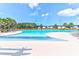 Large community pool with sun loungers and clear blue water, perfect for relaxing and enjoying sunny days at 281 Decatur Dr, Summerville, SC 29486