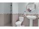 Stylish powder room featuring a modern sink, toilet, and decorative wall tiles at 281 Decatur Dr, Summerville, SC 29486