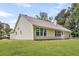 Exterior view of the backyard with a lush lawn and well-maintained landscaping at 2844 Curran Pl, Mount Pleasant, SC 29466
