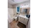 Bright bathroom featuring a tub and shower combo, and a white vanity with a framed mirror at 2844 Curran Pl, Mount Pleasant, SC 29466