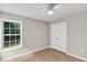 Bedroom with hardwood floors, neutral paint, window view, and double-door closet at 2844 Curran Pl, Mount Pleasant, SC 29466