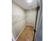 Walk-in closet with ample shelving space, hardwood floors, and an open door at 2844 Curran Pl, Mount Pleasant, SC 29466