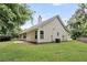 Side view of the home with green grass, siding, and a gable roofline at 2844 Curran Pl, Mount Pleasant, SC 29466
