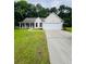 Charming single-story home with a well-manicured lawn and covered front porch at 2844 Curran Pl, Mount Pleasant, SC 29466