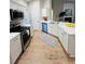 Modern kitchen with stainless steel appliances, white cabinets, and quartz countertops at 2844 Curran Pl, Mount Pleasant, SC 29466