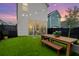 Backyard features a modern patio with outdoor seating and string lights for evening enjoyment at 3 Clearblue Loop, Summerville, SC 29486