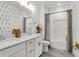 Bright bathroom featuring double vanity, quartz countertops, and gray wood-look tile flooring at 3 Clearblue Loop, Summerville, SC 29486
