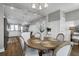 Dining room with a view into the kitchen, featuring an open layout, and modern décor at 3 Clearblue Loop, Summerville, SC 29486