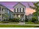 Charming two-story home with a welcoming front porch and manicured landscaping at sunset at 3 Clearblue Loop, Summerville, SC 29486