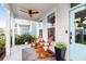 Charming front porch features rocking chairs, overhead fan, and a stylish light blue door with modern accents at 3 Clearblue Loop, Summerville, SC 29486