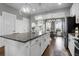 Beautiful kitchen island with granite countertops and stylish pendant lighting at 3 Clearblue Loop, Summerville, SC 29486