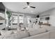 Bright living room featuring a sectional sofa, large windows, and contemporary decor at 3 Clearblue Loop, Summerville, SC 29486