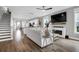 Inviting open-concept living room featuring modern fireplace, television, and bright natural light at 3 Clearblue Loop, Summerville, SC 29486