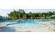 A large community pool with lounge chairs, umbrellas, lifeguard station and multiple water features for relaxation and recreation at 3 Clearblue Loop, Summerville, SC 29486