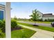 Charming street view highlighting the well-manicured lawns and curb appeal at 3 Clearblue Loop, Summerville, SC 29486