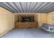 This covered patio features a relaxing porch swing and leads to the carport at 30 Beachside Dr, Isle of Palms, SC 29451