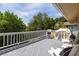 Relax on this home's spacious deck featuring comfortable lounge seating and tranquil views at 30 Beachside Dr, Isle of Palms, SC 29451