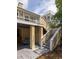Exterior shot of a tan home featuring a swing and stairs to the second story deck at 30 Beachside Dr, Isle of Palms, SC 29451