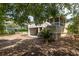 Charming home with a screened-in porch and a spacious deck surrounded by lush greenery at 30 Beachside Dr, Isle of Palms, SC 29451