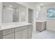 Contemporary bathroom with a double sink vanity, glass shower, and ample lighting at 3029 Robeson Trce, Johns Island, SC 29455