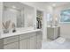 Bright bathroom with double vanity, walk-in closet, and modern fixtures at 3029 Robeson Trce, Johns Island, SC 29455