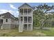 Charming two-story home with a white garage, inviting porch, and meticulously landscaped front yard at 3029 Robeson Trce, Johns Island, SC 29455