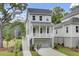 Two-story home with a covered porch, garage, and well-maintained landscaping at 3029 Robeson Trce, Johns Island, SC 29455