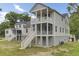 Charming two-story home with screened porches, elevated design, and inviting curb appeal at 3029 Robeson Trce, Johns Island, SC 29455