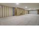 Spacious unfinished garage with stairs leading up and ample room for parking and storage at 3029 Robeson Trce, Johns Island, SC 29455