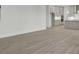 Expansive living room showing open floor plan and sleek modern flooring at 3029 Robeson Trce, Johns Island, SC 29455