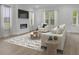 Cozy living room with fireplace, neutral furnishings, and plenty of natural light at 3029 Robeson Trce, Johns Island, SC 29455