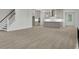 Open-concept living area with views of a modern kitchen and staircase at 3029 Robeson Trce, Johns Island, SC 29455